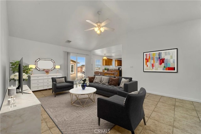 tiled living room with vaulted ceiling and ceiling fan