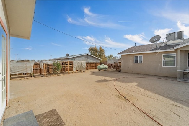 view of yard featuring cooling unit and a patio area