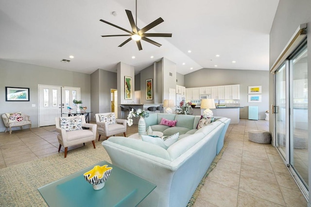 tiled living room featuring french doors, high vaulted ceiling, and ceiling fan