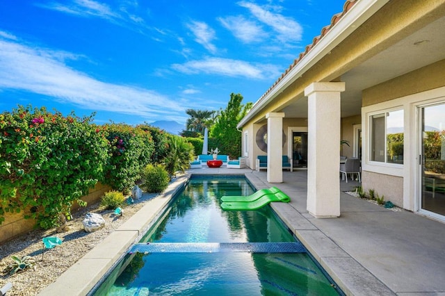 view of pool featuring a patio area