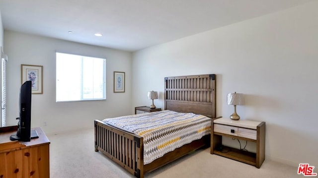 bedroom with light colored carpet