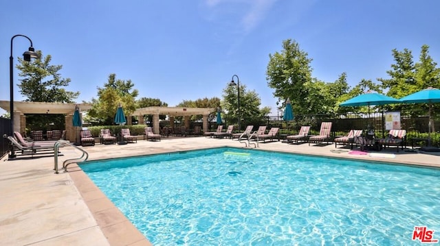 view of swimming pool with a patio