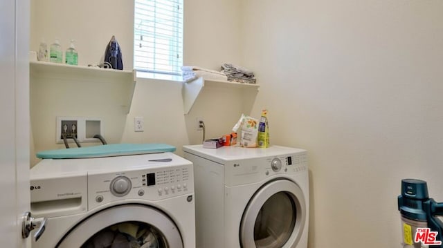 laundry room with washing machine and dryer