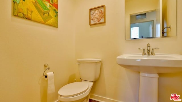 bathroom with sink and toilet