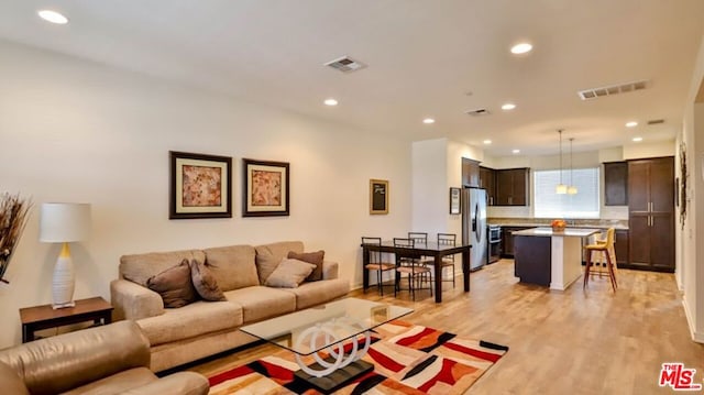 living room with light hardwood / wood-style floors