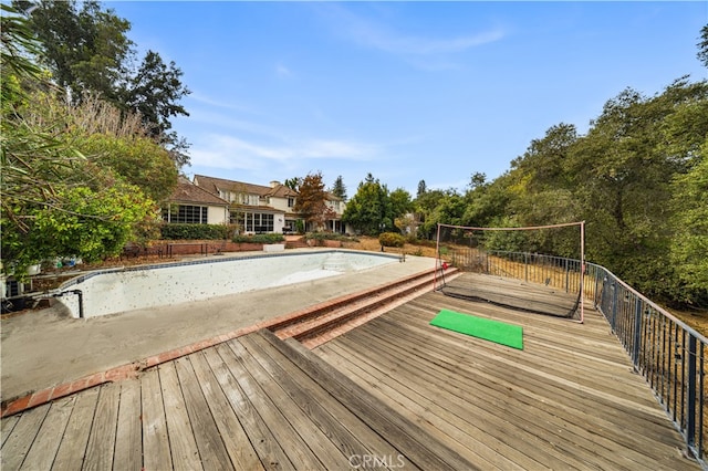 view of pool with a wooden deck