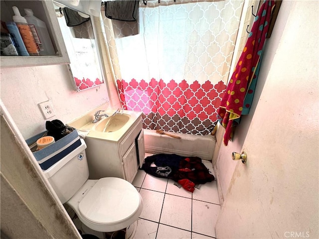 full bathroom featuring tile patterned floors, vanity, toilet, and shower / bath combo with shower curtain