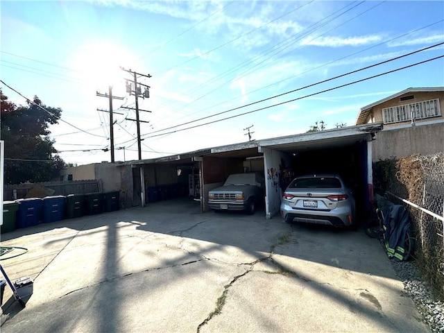 view of front of property featuring a carport