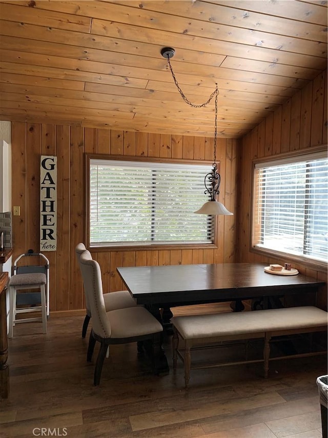 dining space featuring wood-type flooring, wood ceiling, and vaulted ceiling