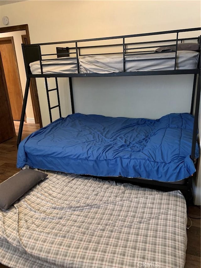 bedroom featuring wood-type flooring