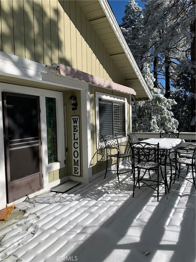 view of snow covered deck