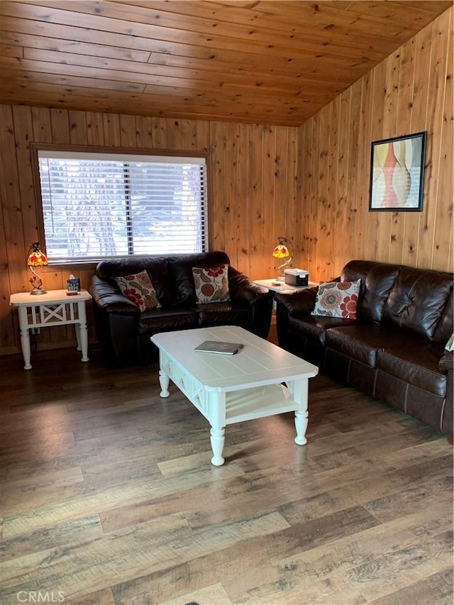 living room featuring dark hardwood / wood-style flooring, wood ceiling, and wooden walls