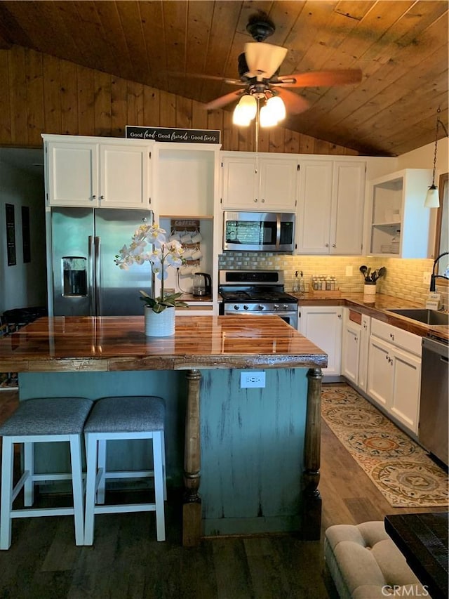 kitchen featuring sink, stainless steel appliances, and white cabinetry