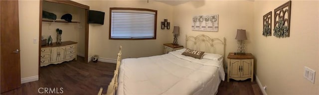 bedroom with dark wood-type flooring