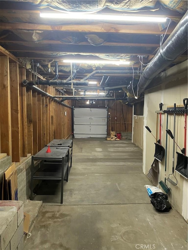 garage featuring wood walls