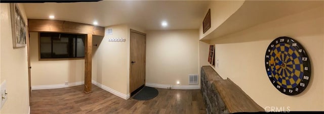 hallway featuring dark hardwood / wood-style flooring