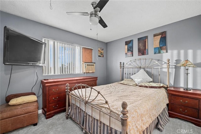 bedroom featuring ceiling fan, cooling unit, and light carpet