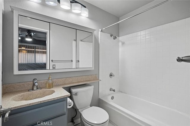 full bathroom with vanity, toilet, and tiled shower / bath combo