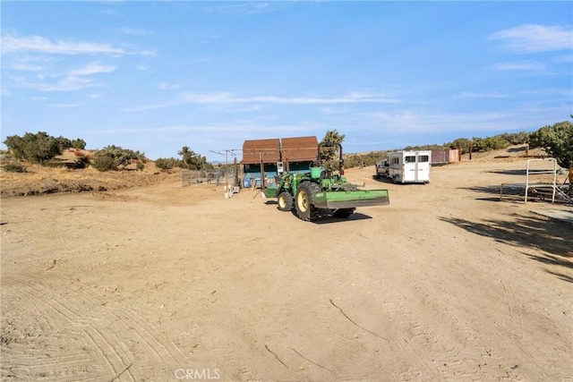 view of yard with a rural view