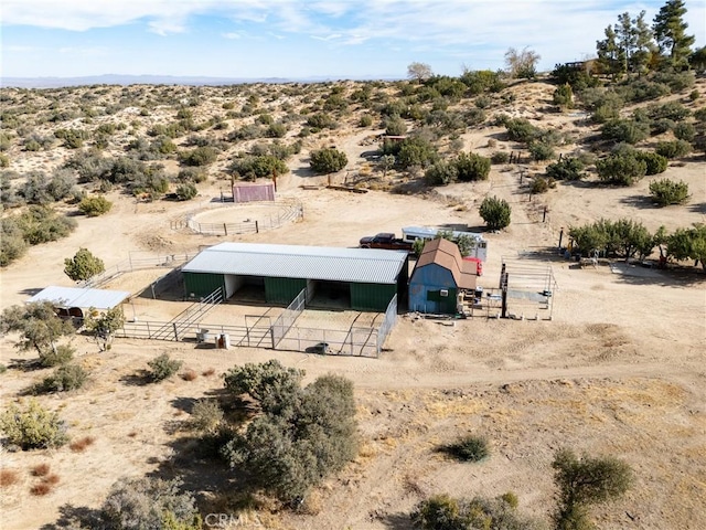 birds eye view of property featuring a rural view