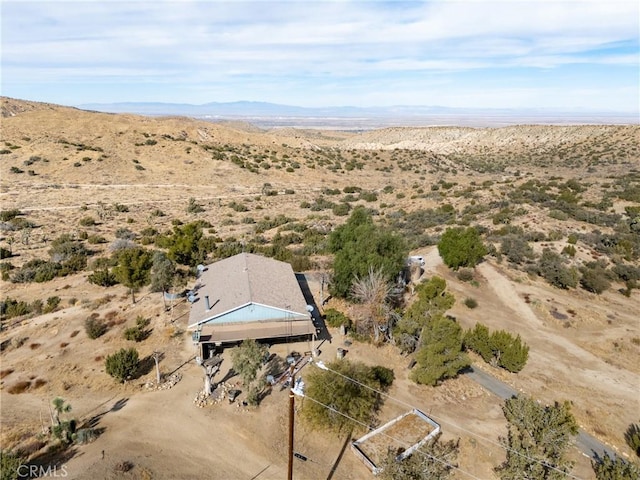 drone / aerial view featuring a mountain view