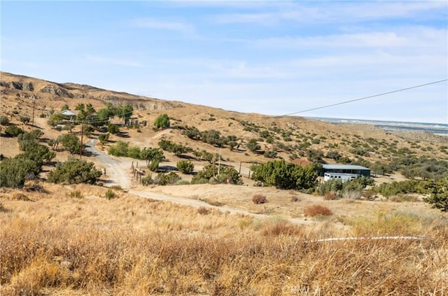 view of mountain feature with a rural view