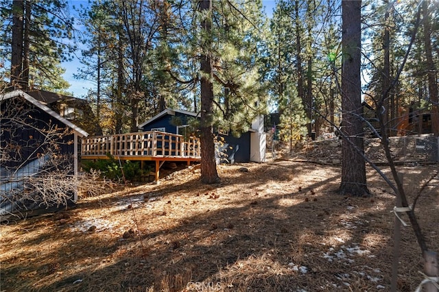 view of yard with a wooden deck