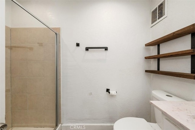 full bathroom featuring toilet, a stall shower, visible vents, and vanity