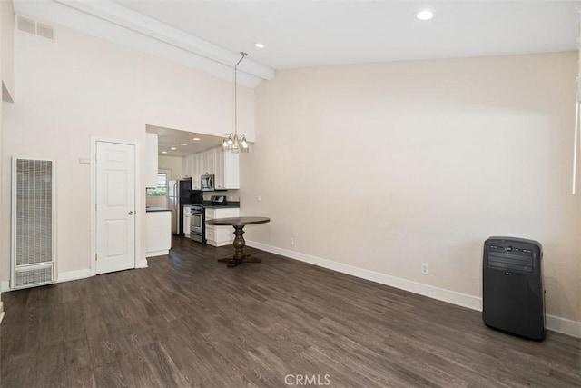 unfurnished dining area featuring dark wood-style flooring, recessed lighting, visible vents, and baseboards