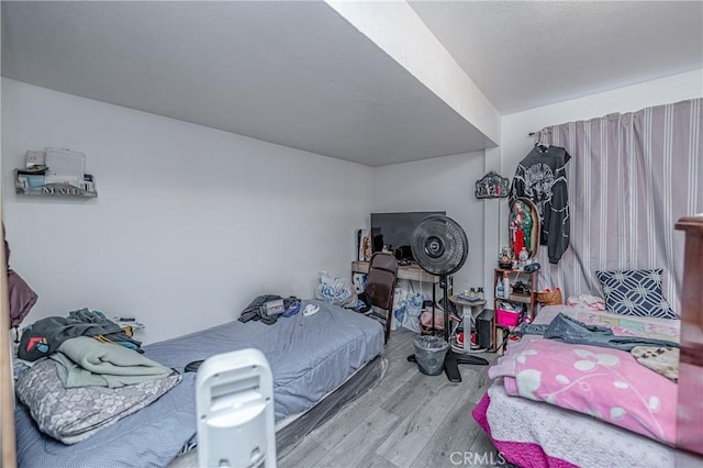 bedroom with light hardwood / wood-style flooring