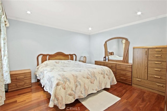 bedroom with hardwood / wood-style flooring and ornamental molding