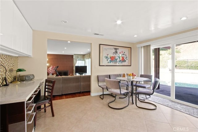 dining space with light hardwood / wood-style flooring