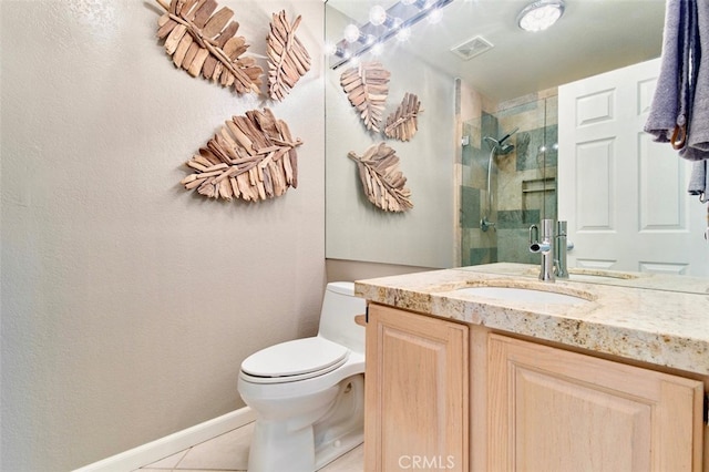 bathroom featuring tile patterned floors, a shower with door, vanity, and toilet