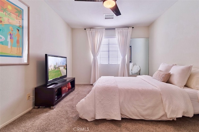 bedroom featuring ceiling fan and light carpet