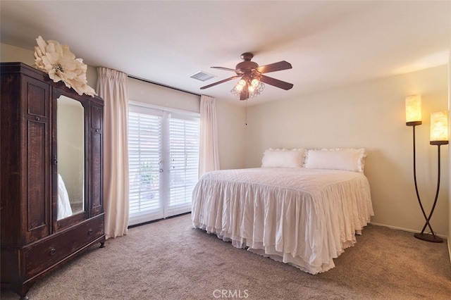 carpeted bedroom featuring ceiling fan and access to exterior