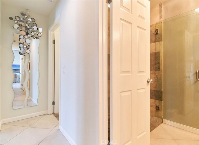 hallway featuring light tile patterned floors