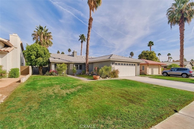 ranch-style house with a garage and a front lawn