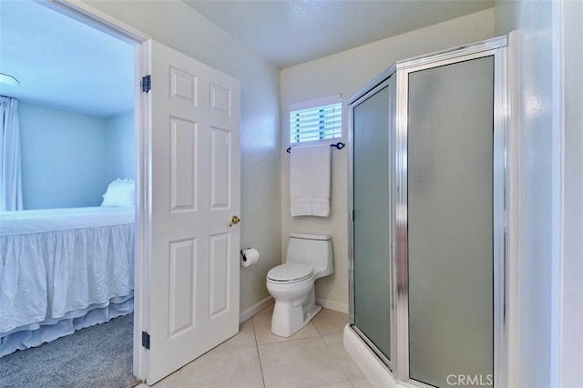 bathroom with tile patterned flooring, an enclosed shower, and toilet