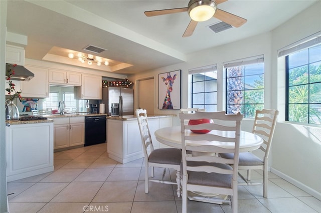 kitchen featuring white cabinets, ceiling fan, dishwasher, stainless steel fridge with ice dispenser, and light tile patterned flooring