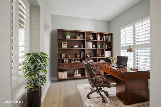 office space with light hardwood / wood-style floors