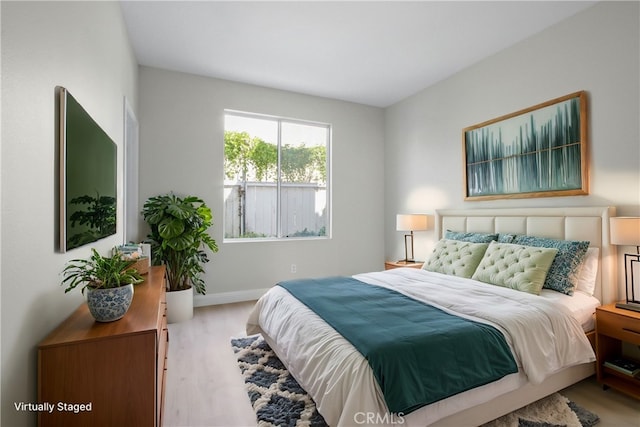 bedroom with light wood-type flooring