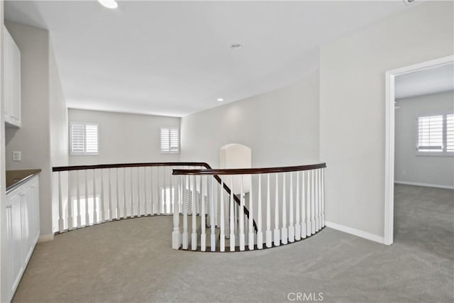 hallway featuring carpet flooring