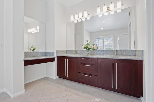 bathroom featuring tile patterned flooring and vanity