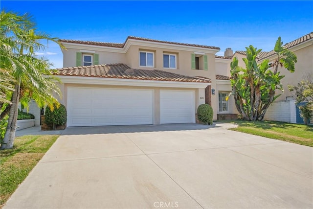 mediterranean / spanish-style home with a garage