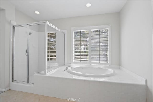 bathroom featuring tile patterned floors and shower with separate bathtub