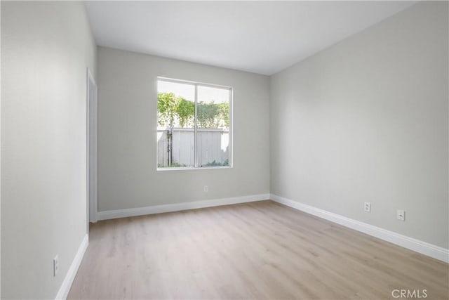 spare room featuring light hardwood / wood-style floors