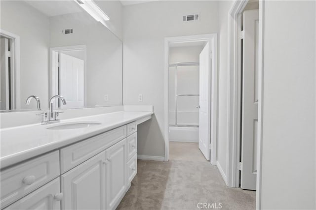 bathroom with vanity and an enclosed shower