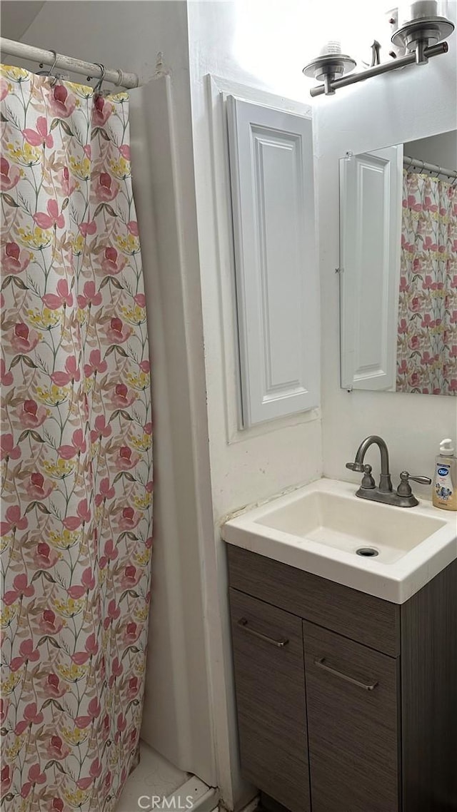 bathroom with vanity and walk in shower