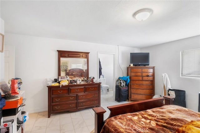 bedroom with connected bathroom