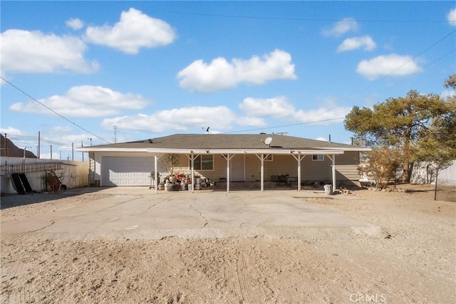 back of property featuring a garage